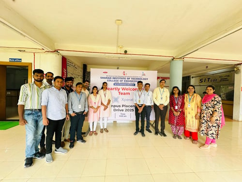 Team in front of banner